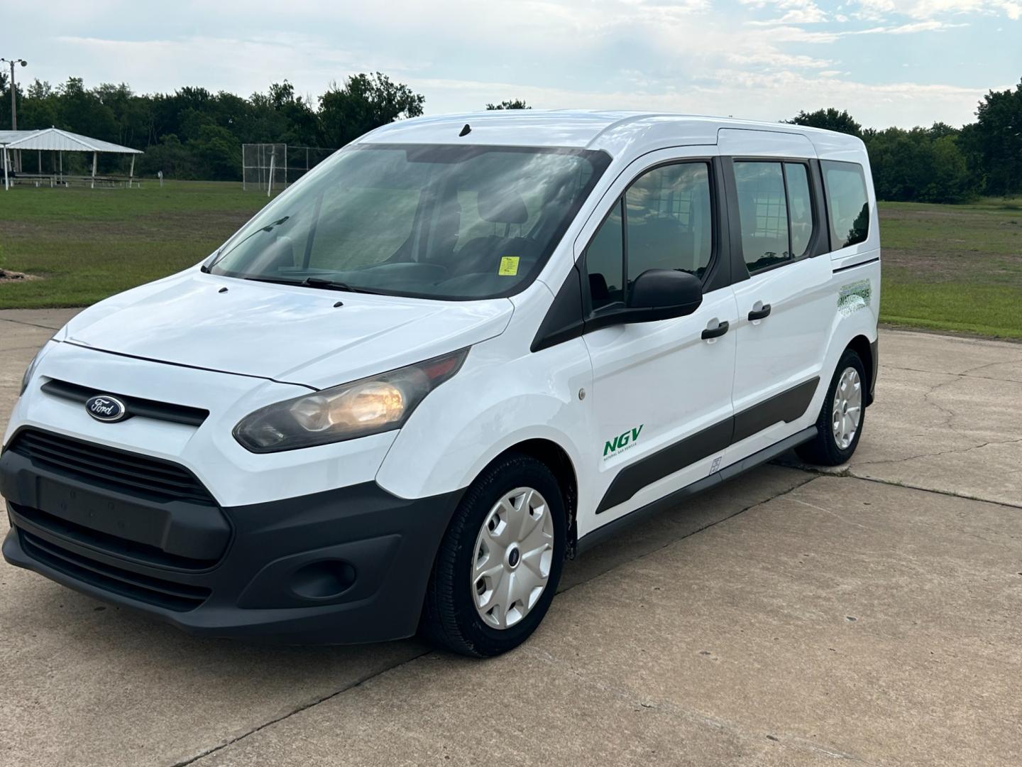 2014 White /Gray Ford Transit Connect Wagon XL w/Rear Liftgate LWB (NM0GE9E75E1) with an 2.5L L4 DOHC 16V engine, 6-Speed Automatic transmission, located at 17760 Hwy 62, Morris, OK, 74445, (918) 733-4887, 35.609104, -95.877060 - 2014 FORD TRANSIT CONNECT HAS 2.5L ENGINE, FEATURES POWER LOCKS, POWER WINDOWS, POWER MIRRORS, AM/FM STEREO, CRUISE CONTROL, BLUETOOTH HANDS-FREE CALLING, BACKSEAT,IT RUNS ON CNG (COMPRESSED NATURAL GAS) OR GASOLINE. A PREMIER ALTERNATIVE FUEL CONVERSION THAT IS EPA-APPROVED. EXTREMELY CLEAN-BURNING - Photo#0